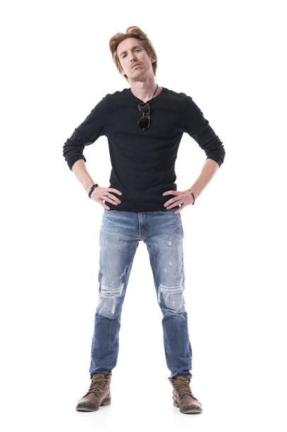 Dissatisfied young handsome red hair man with hands on hips looking at camera with suspicious. Full body length isolated on white background.  - Fotoğraf, Görsel
