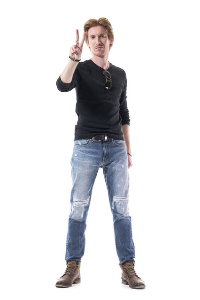 Happy confident young man showing two finger peace sign at camera with smirking smile. Full body length isolated on white background.  - Fotografie, Obrázek