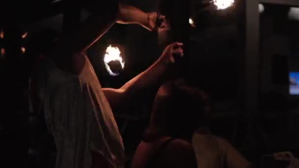 Professional artists staged a nightly show in a cafe or restaurant entertaining visitors and waving fireballs over peoples heads in Nha Trang, Vietnam, May 8, 2020. - Кадри, відео