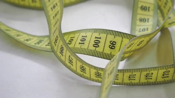 The measuring tape lies on the table. - Footage, Video