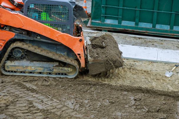 Landscaping works on the bulldozer moves soil digging ground construction earthmoving - Fotografie, Obrázek