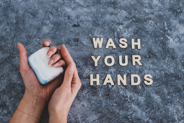 keep clean to fight bacteria and viruses, hand holding soap next to Wash your Hands text	 - Фото, изображение
