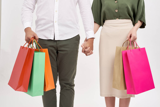 Woman and man holding shopping bags with copy space - Photo, Image