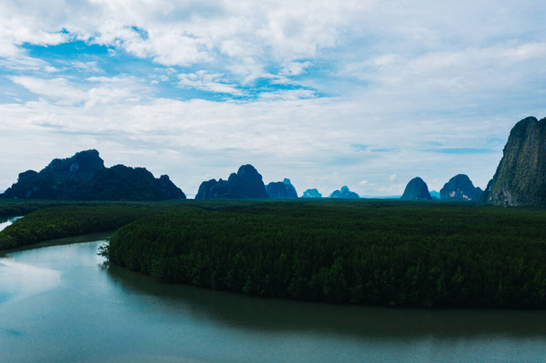 Aerial scenery view of mangroves forest, river canals and mountains. Bird's eye view of beautiful panoramic nature landscape of tropical water jungle on Ao Phang Nga bay National Park, Thailand - Foto, Imagen