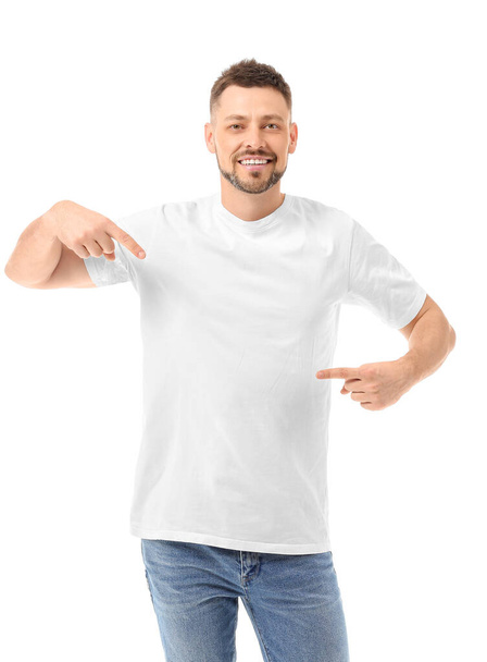 Man in stylish t-shirt on white background - Photo, image