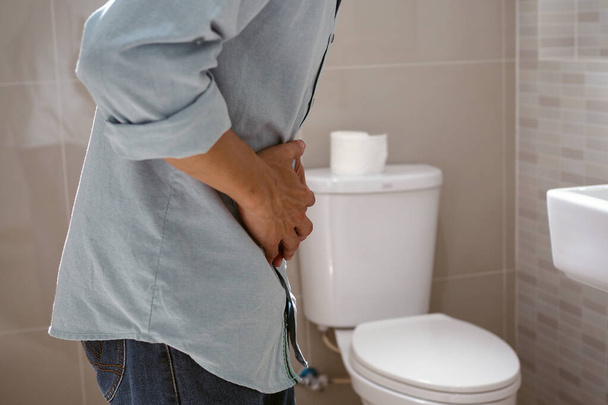Men have abdominal pain. Want to shit. diarrhea concept - 写真・画像