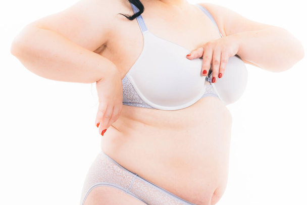 Plus size woman belly fat in lingerie. Overweight mature female wearing underwear, isolated on white. - Valokuva, kuva