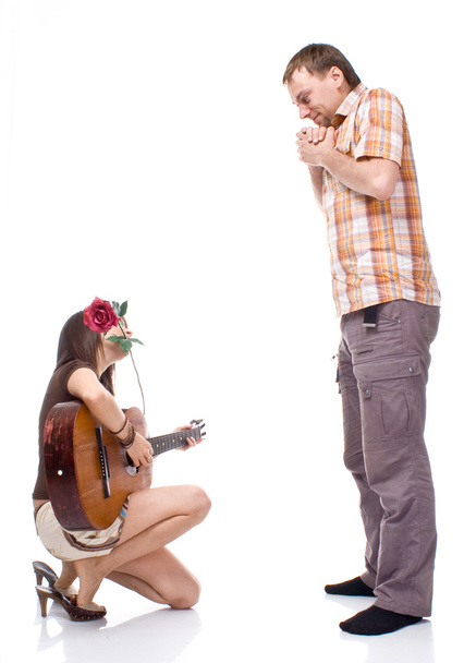 Girl plays the guitar for a boy - 写真・画像