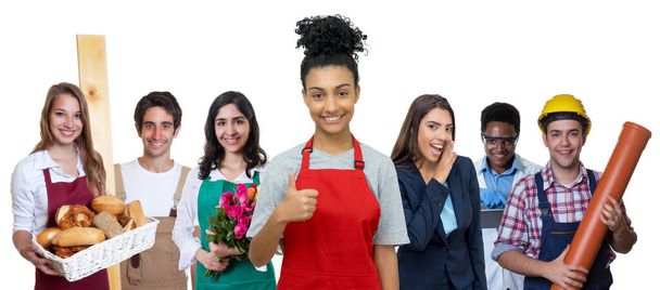 Young hispanic waitress with group of international apprentices isolated on white background for cut out - Photo, Image