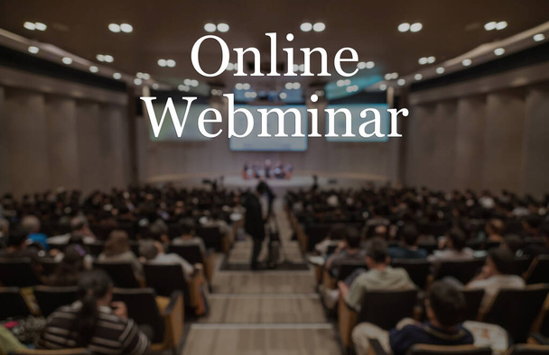 Online Webinar Text over blur photo of conference hall or seminar room without attendee background, Offline is over,online transmission and television production broadcast is new normal,covid outbreak - Photo, Image