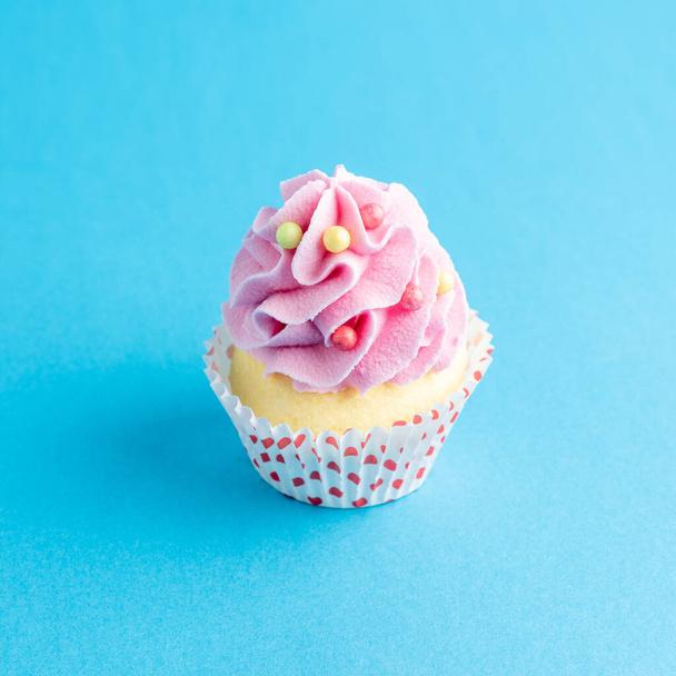 Colorful celebration background with cupcake. Minimal party concept. - Foto, imagen