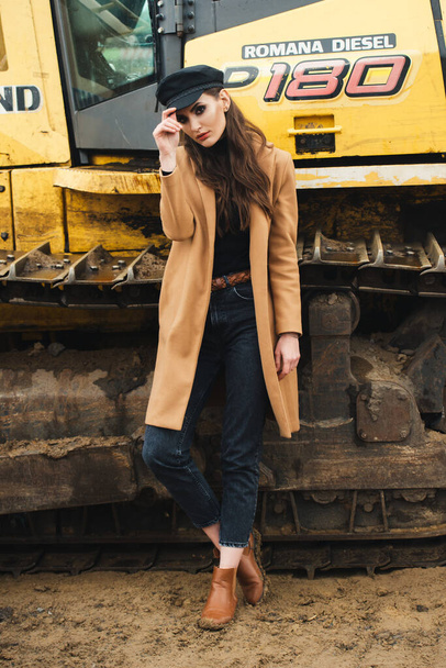 young woman posing near excavator - Fotografie, Obrázek