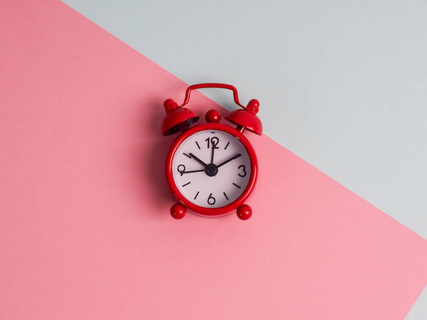 Metal retro vintage alarm clock wakeup clips clipboard, paper sheet pencil notepad lying colored background empty text important events what to do office school home. - Photo, image