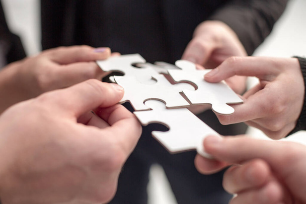 Closeup hand connecting jigsaw puzzle with, business solutions, success and strategy concept - Photo, Image