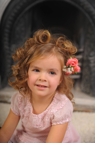 happy little girl with flowers in hair portrait - Foto, Bild