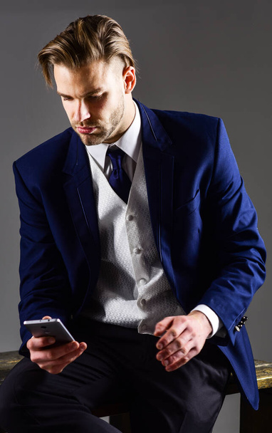 Man in classic suit or businessman on dark background. - Zdjęcie, obraz