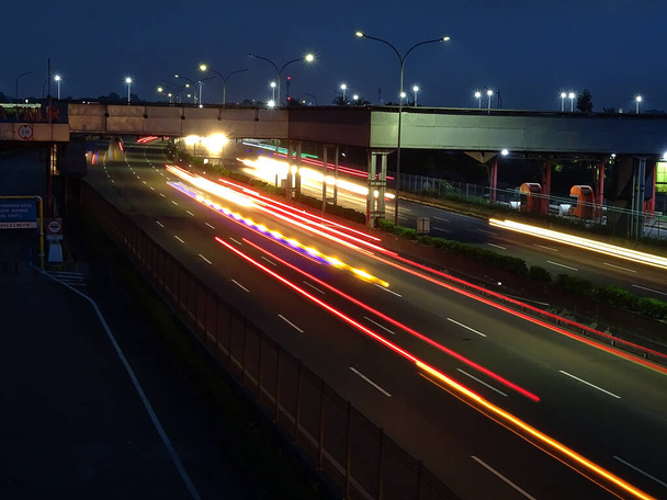 Long Exposure photo of the Jakarta Merak Highway at night at the East Balaraja toll gate. - Photo, Image