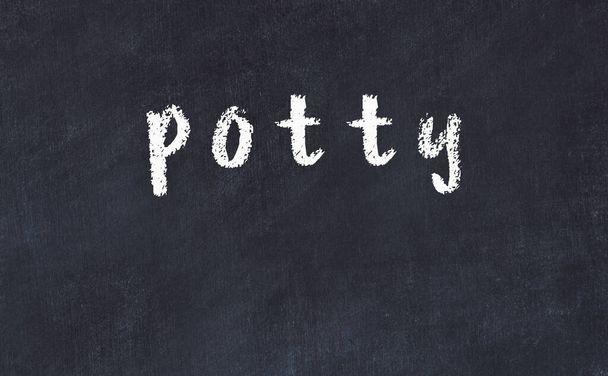 College chalk desk with the word potty written on in - Photo, Image
