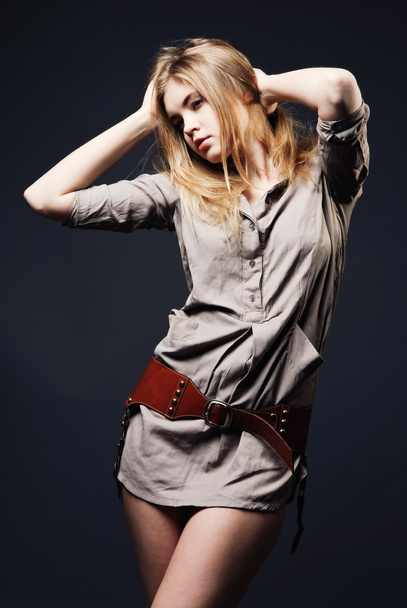 Seductive fashion portrait of young woman on dark background - Foto, immagini