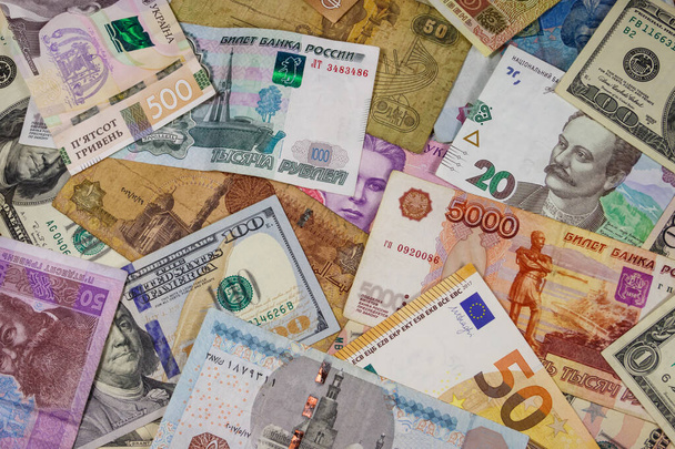 Multicurrency achtergrond van euro 's Us dollars, Russische roebel, Egyptische ponden en Oekraïense hryvnias - Foto, afbeelding