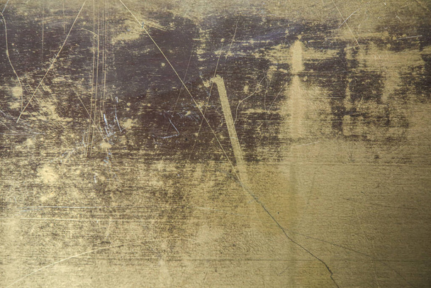 Textur der Oberfläche des Messingblattes, in Kratzern, Hintergrund, Nahaufnahme - Foto, Bild
