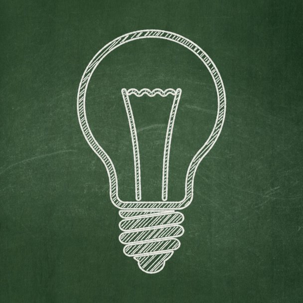 Business concept: Light Bulb on chalkboard background - Photo, Image