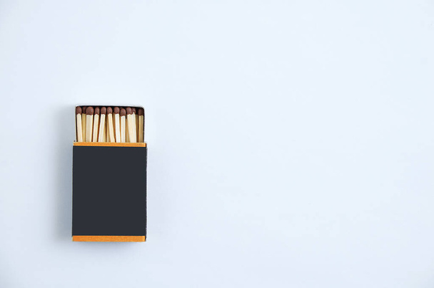 Open matchbox. White background. View from above. Place for text. - 写真・画像