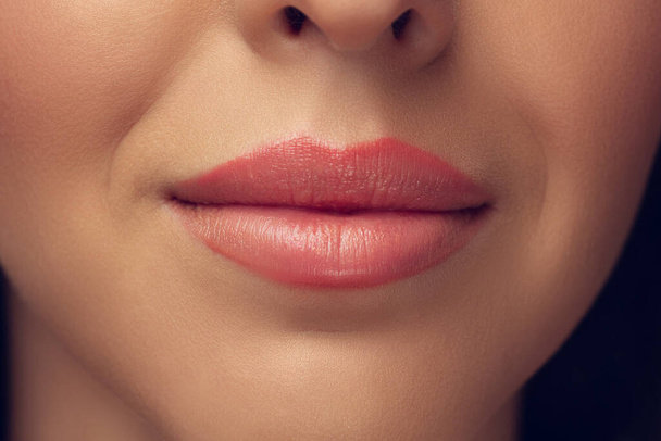 Close up of beautiful female face, lips with bright stylish make up isolated on grey studio backgroud - Foto, Imagem