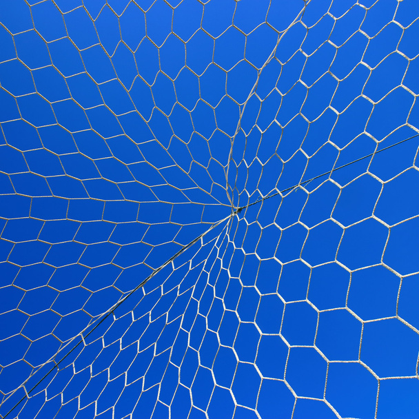 Футбольна мережа на блакитному небі
 - Фото, зображення