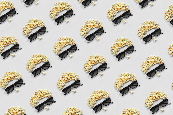 Pattern made with abstract image of viewer, 3D glasses and popcorn on grey background. Creative concept cinema movie and entertainment Flat lay Top view. - Foto, immagini
