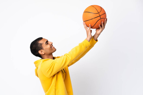 African American man over isolated white background playing basketball - Fotoğraf, Görsel