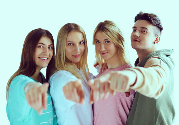 Young people pointing at you standing together - Zdjęcie, obraz