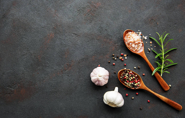 Top view of spices on dark concrete background. Flat lay.  - Foto, Imagen