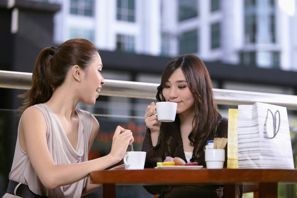 Women having coffee together - Фото, зображення