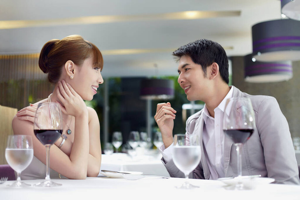 Man and woman talking over a romantic date - Фото, изображение