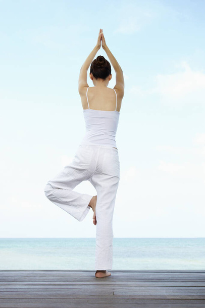 young woman practicing yoga - Φωτογραφία, εικόνα