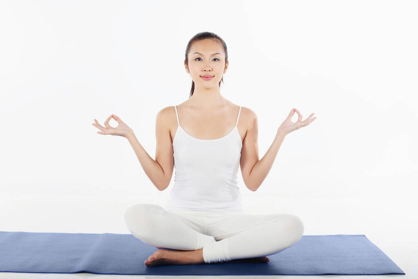young woman practising yoga - Photo, image