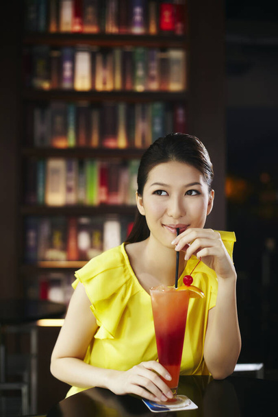 Woman enjoying her drink - Valokuva, kuva
