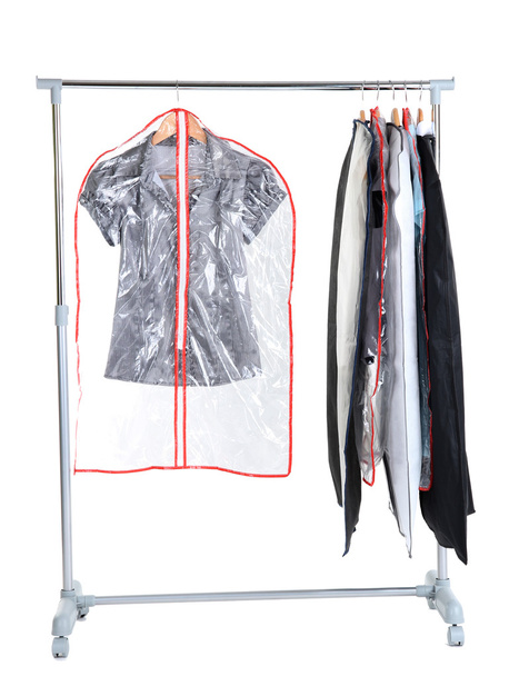 Office female clothes in cases for storing on hangers, isolated on white - Фото, изображение