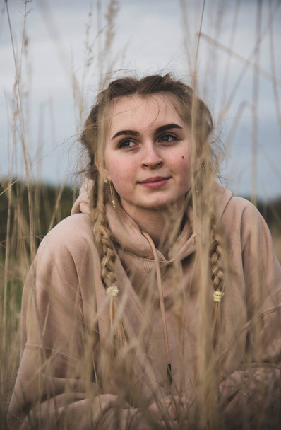  Portrait of a teenage girl, made through the ears. - Φωτογραφία, εικόνα