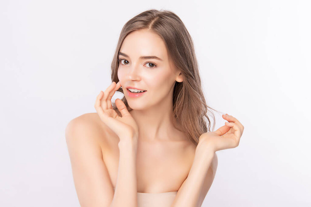 Beautiful Young Woman touching her clean face with fresh Healthy Skin, isolated on white background, Beauty Cosmetics and Facial treatment Concept - Photo, Image