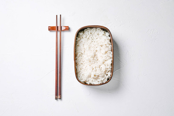 bento box with rice and chopsticks. - Zdjęcie, obraz