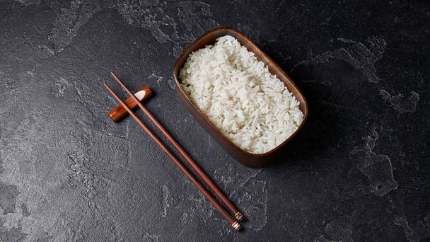 bento box with rice and chopsticks. - Foto, Imagem