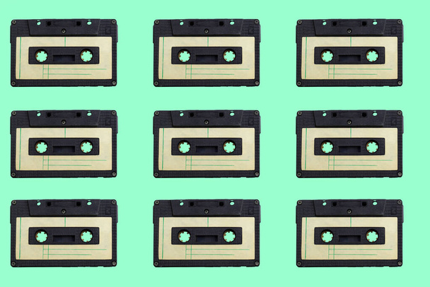 vintage audio cassettes pattern  on a green background - Zdjęcie, obraz