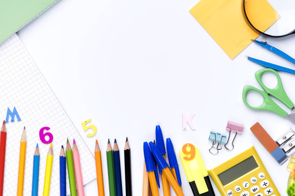Many different school supplies on white copy space background. Back to school concept. - Photo, Image
