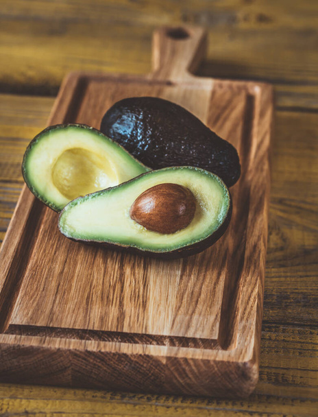 Fresh avocado on the wooden board - Photo, Image