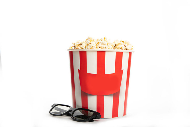 Paper cup with popcorn and 3D glasses isolated on white - Foto, immagini