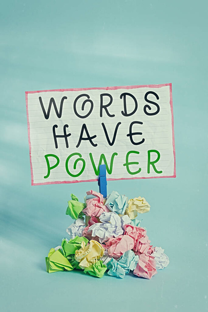 Conceptual hand writing showing Words Have Power. Business photo showcasing as they has ability to help heal hurt or harm someone Reminder pile colored crumpled paper clothespin wooden space. - Photo, Image