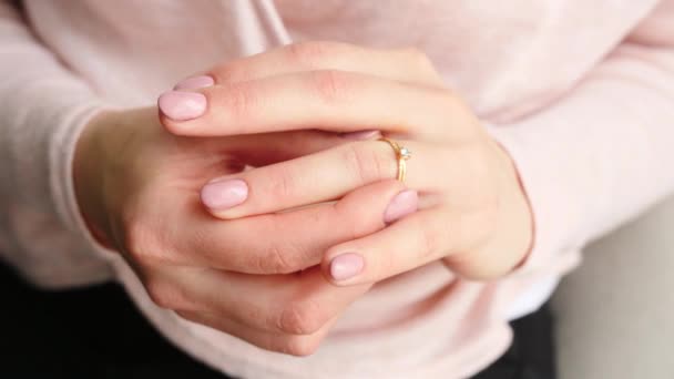 Young woman putting beautiful ring on her finger, closeup - Кадри, відео