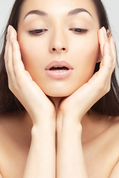 Portrait of young beautiful woman with clean perfect skin. Beauty and skin care - 写真・画像